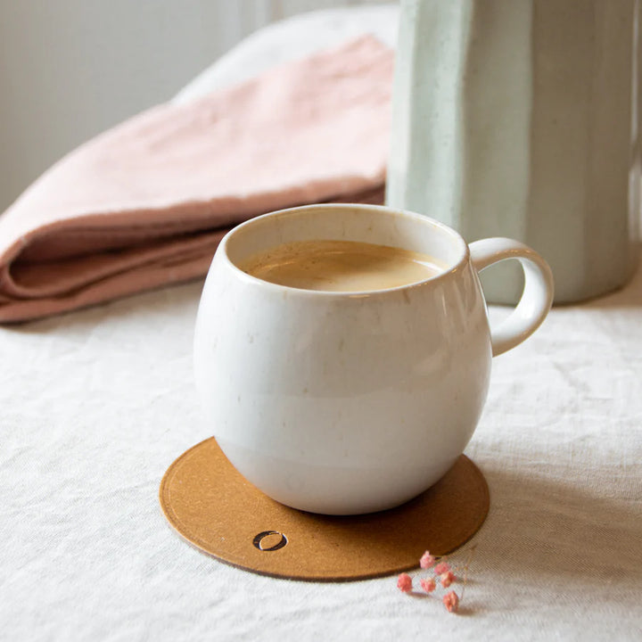 a hot drinks mug on Maison Origin leather coaster