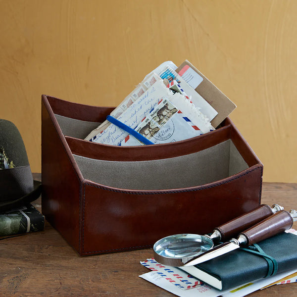 leather letter rack next to magnifying glass