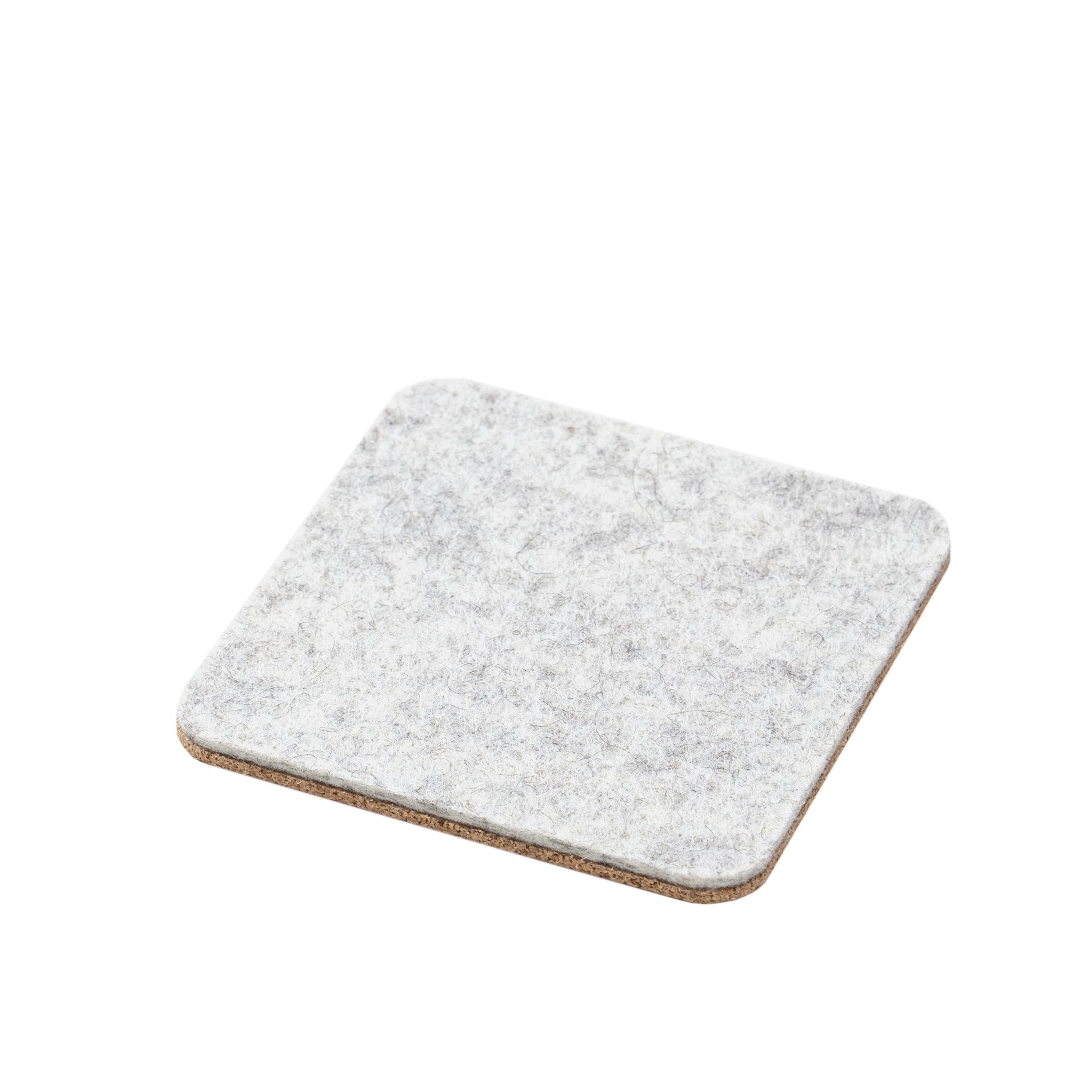 a white wool and cork coaster on a white background