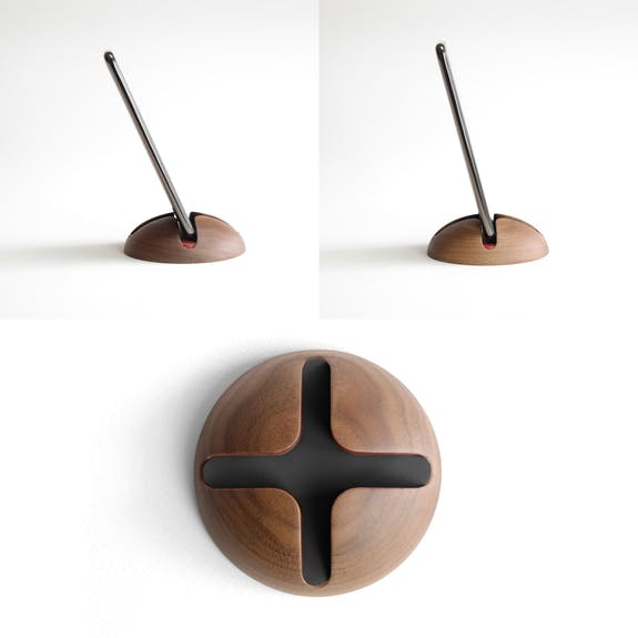 triple image showing the black button phone stand from various angles