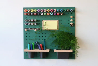 green quark pegboard with stationary and cotton holders