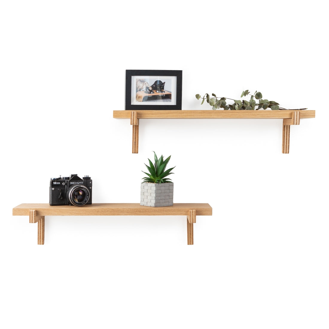 twin set of oak shelves against a white wall in an office