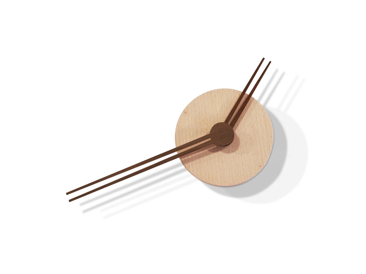 Capriccio wall clock in walnut against white background