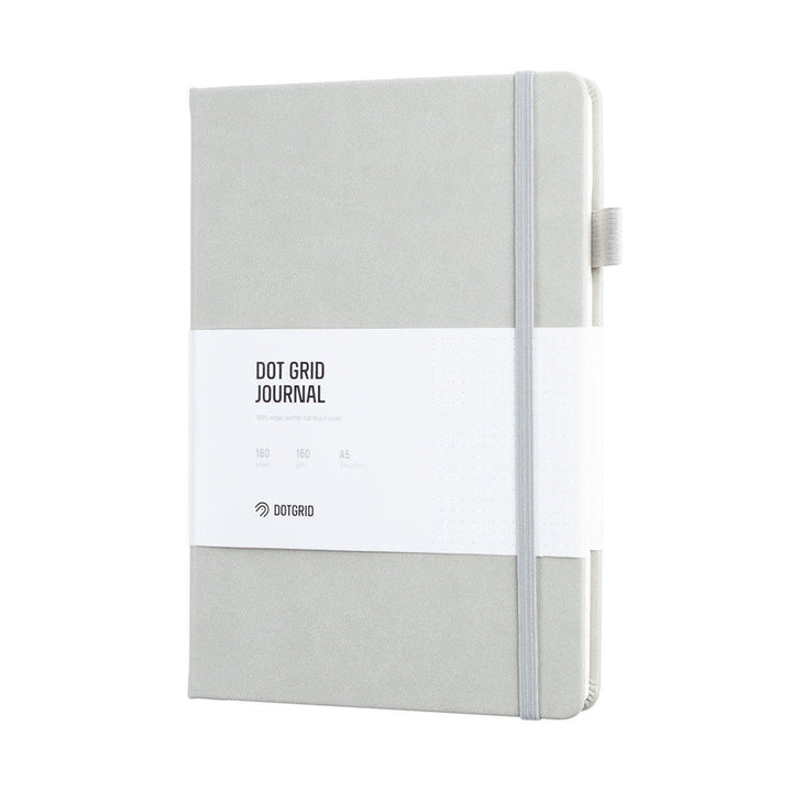 white dot grid journal on white background 