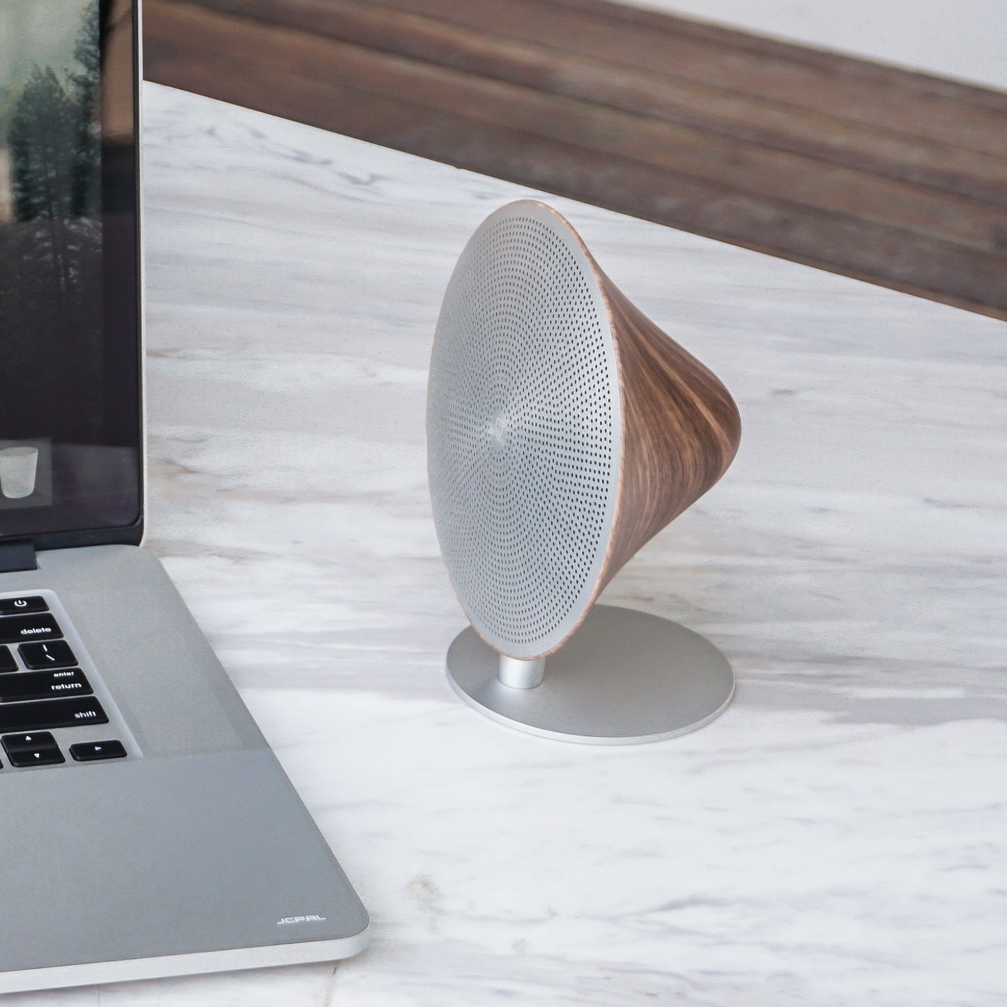 gingko mini halo one speaker next to MacBook pro