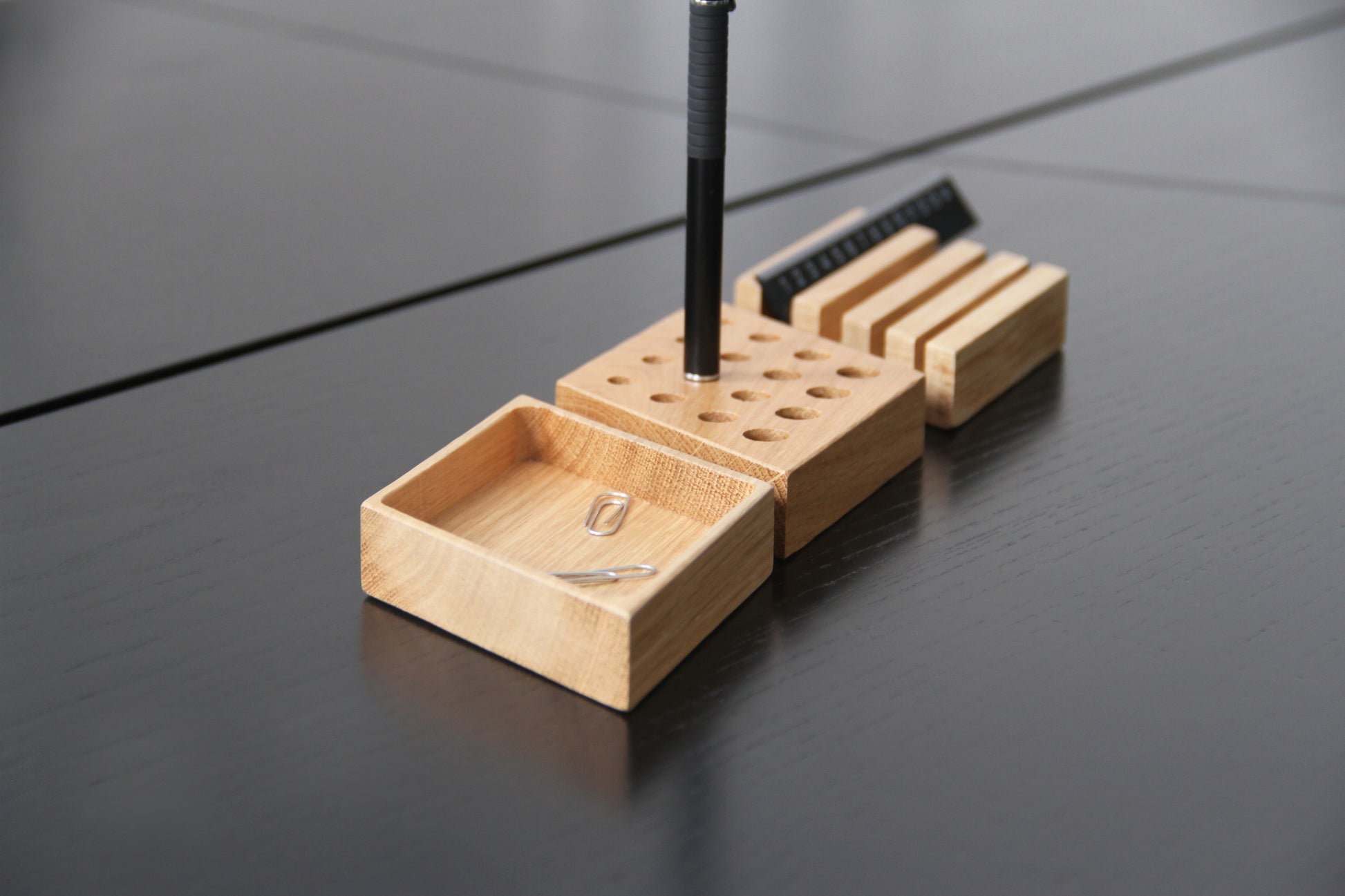 kesito organiser split into three on a wooden desk
