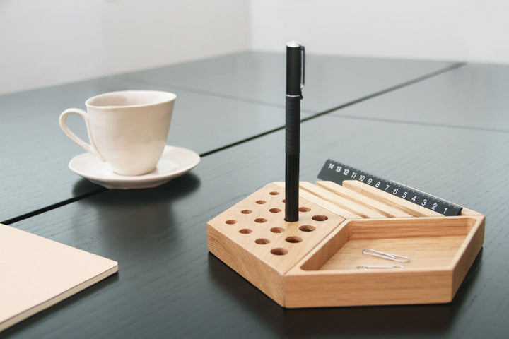 kesito pen holder next to a mug of coffee in a home office