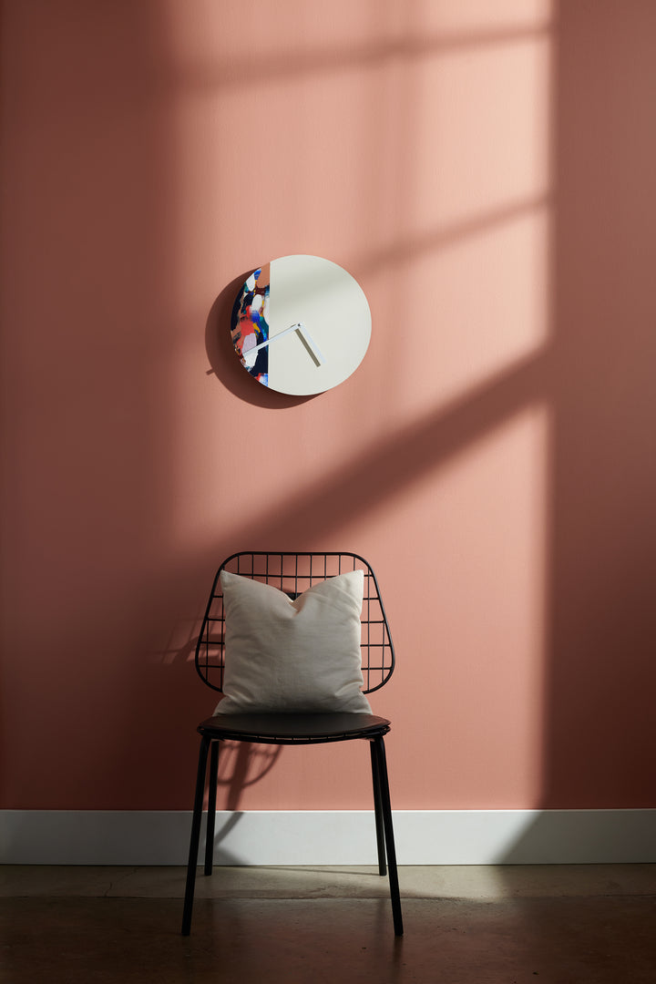 swirl USA hand built clock in front of a chair