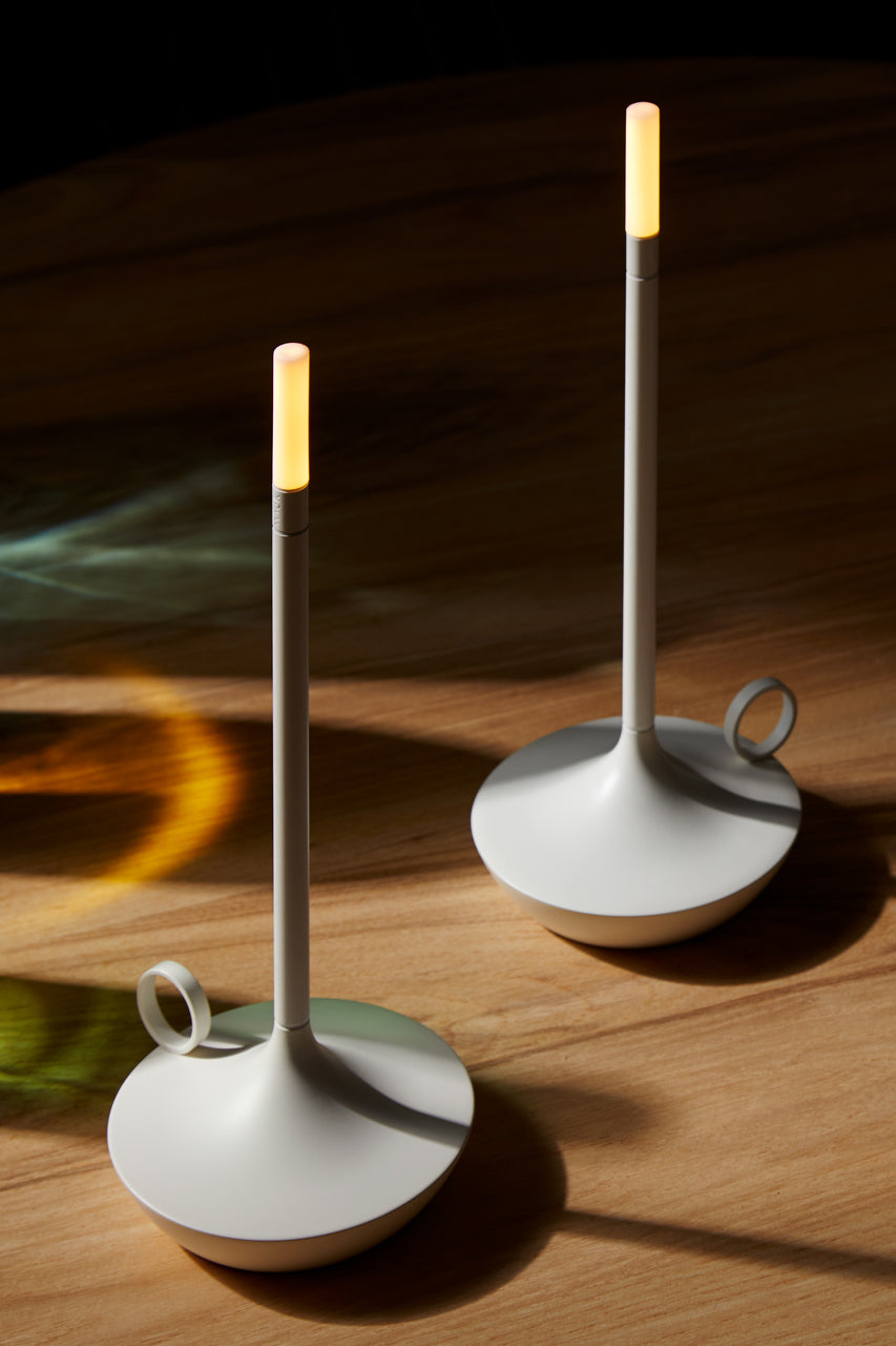 two of The Wick Lamps in white on wooden desk