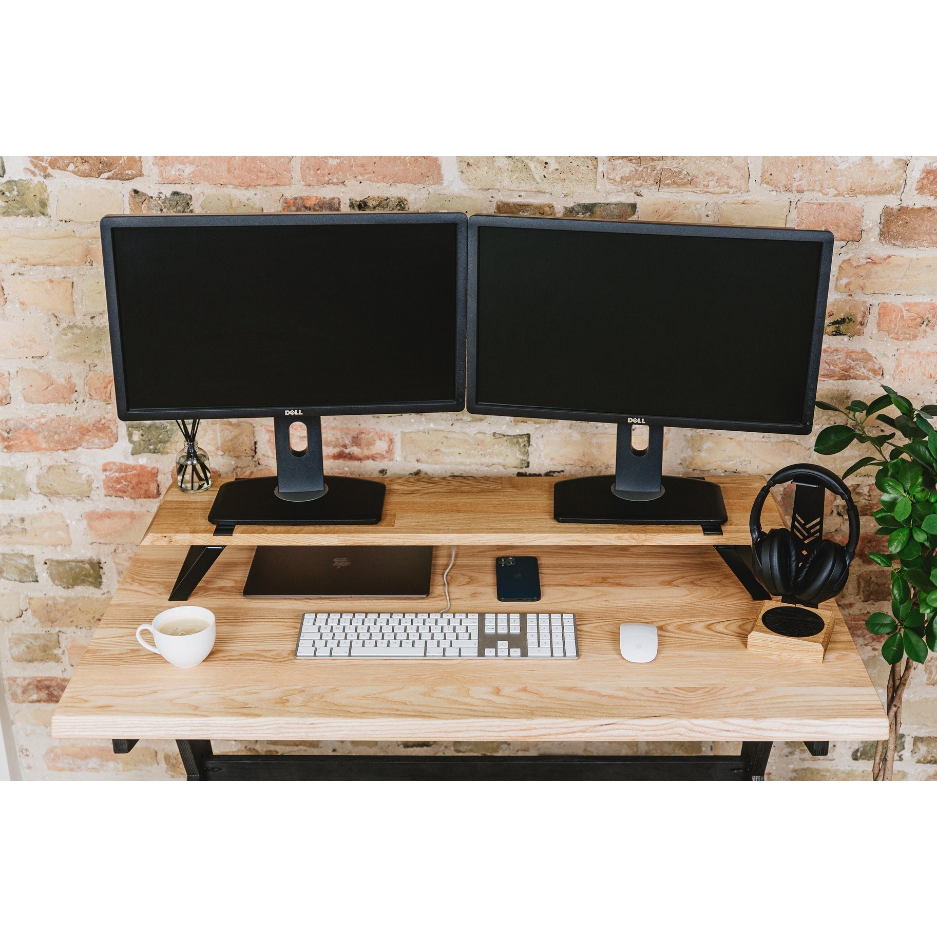Halostands Dual Monitor Stand on wooden desk with two monitors on top