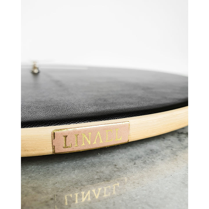 side view of xl black leather wall clock by lineal