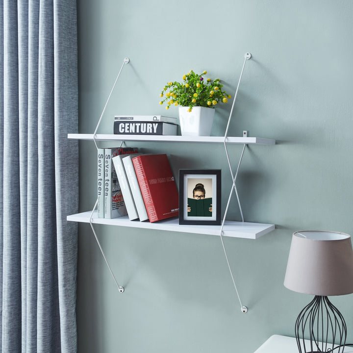 Wooden shelving on wall with books on top