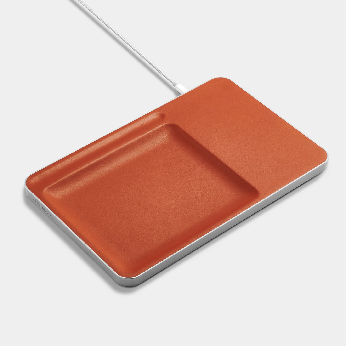Cognac Leather charging station over white background