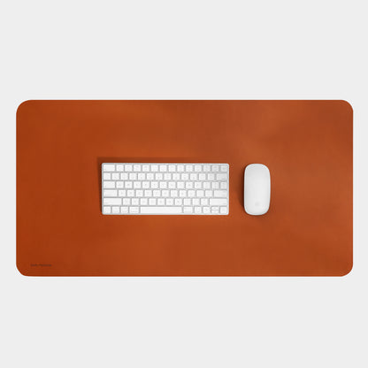 carl friedrik desk mat on white background with apple mouse and keyboard on top