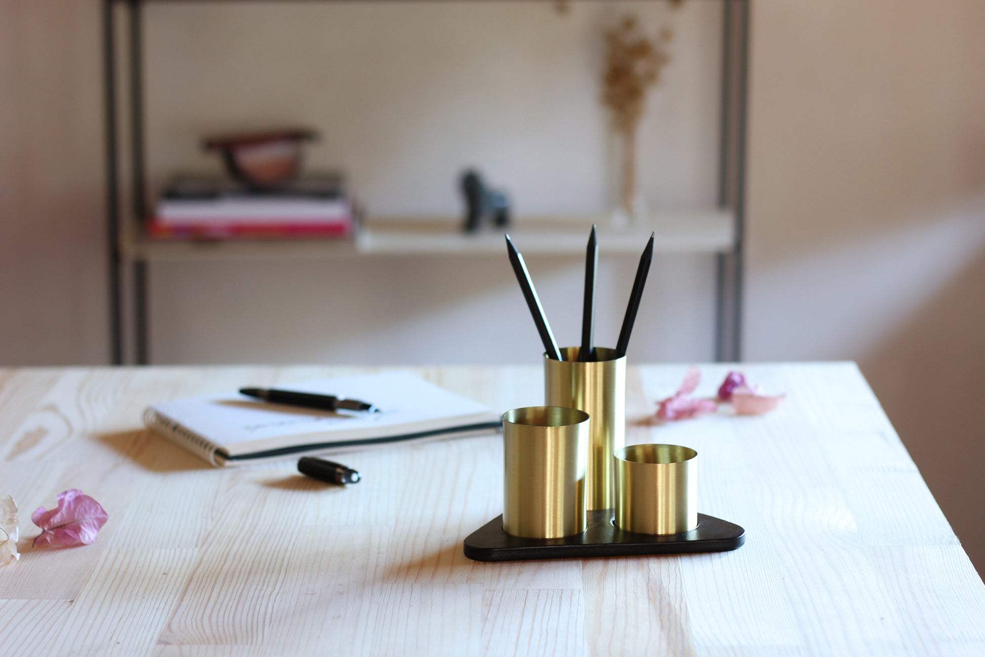 gold on black, stylish pen pot on writers desk