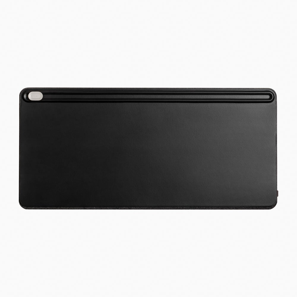 black orbit key desk mat showing the magnetic cable holder against a white background