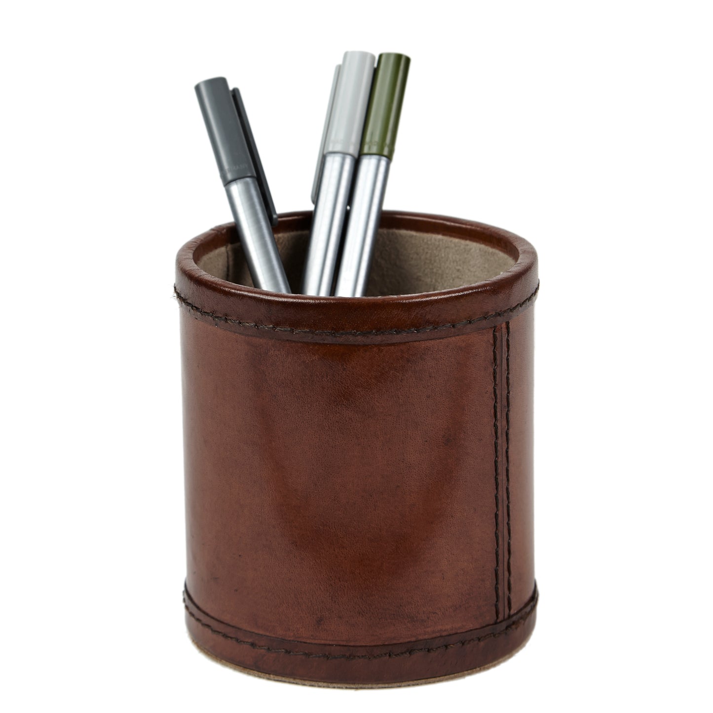 leather pen pot with pens in on white background