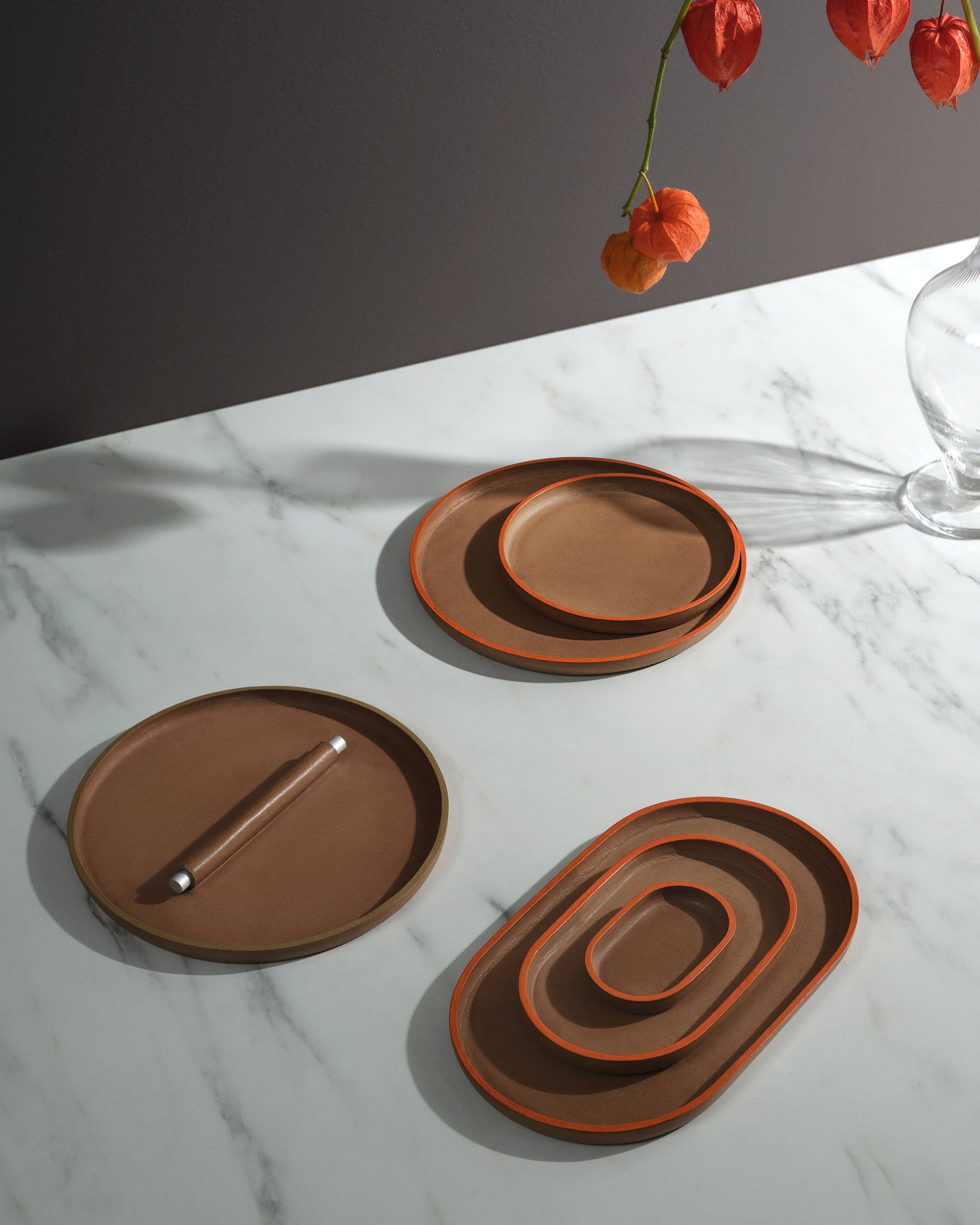 trio of plato plates on white marble table