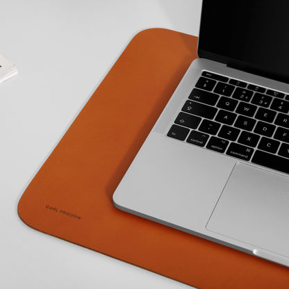 Cognac leather desk mat under MacBook Pro