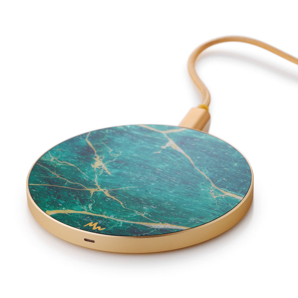 green and gold wireless charger for phones on white background