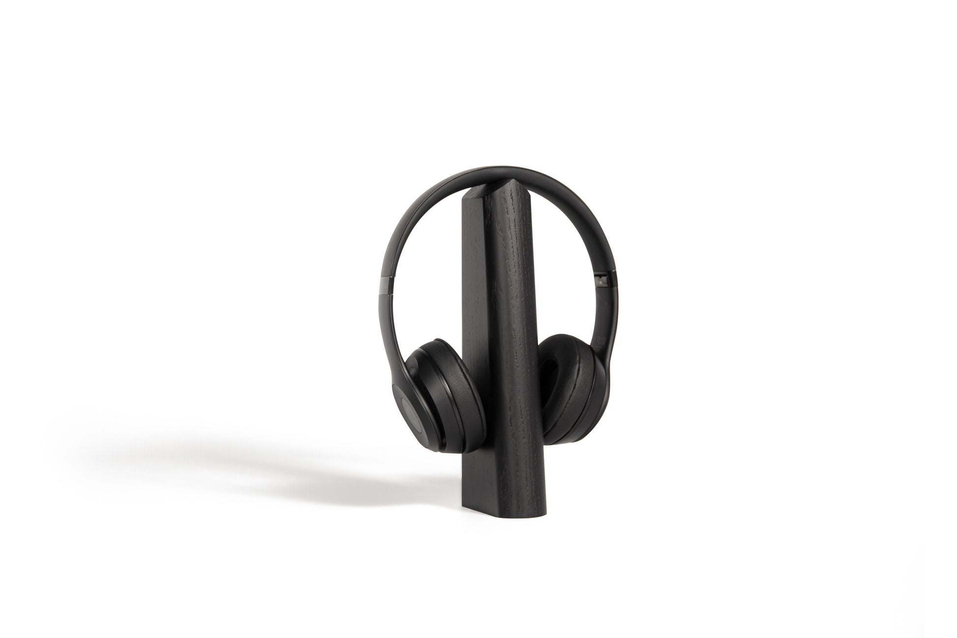mallo geo in black with Beats headphones over the top on a white background
